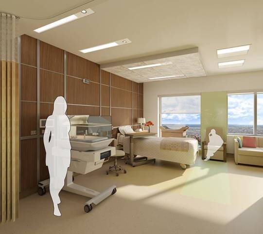 The labour, delivery and post-partum room featuring warm, natural wood accents, floor-to-ceiling windows and ample space for family members.